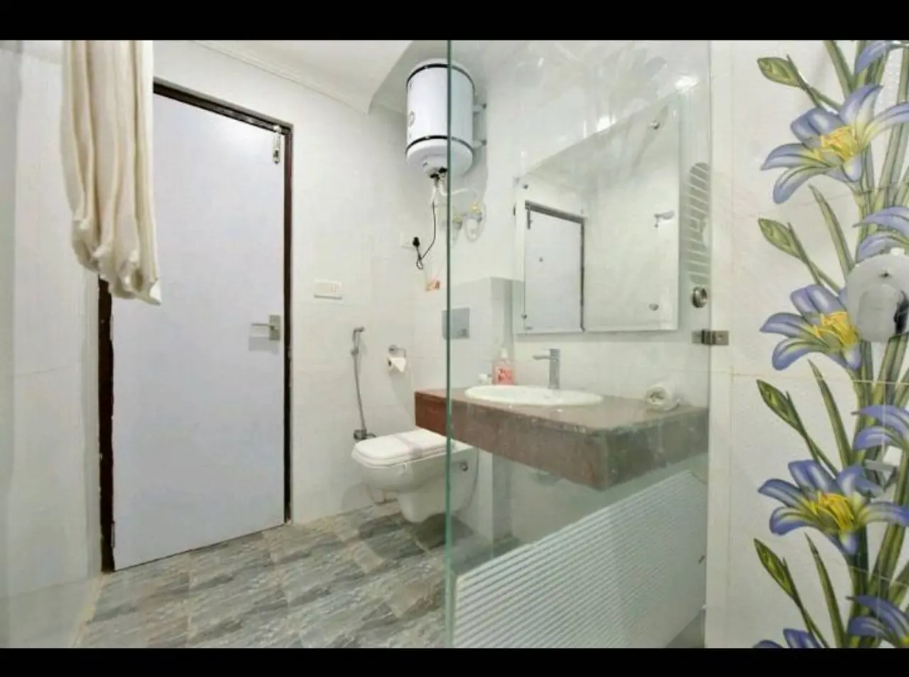 Bathroom with wall-hung toilet and mirror